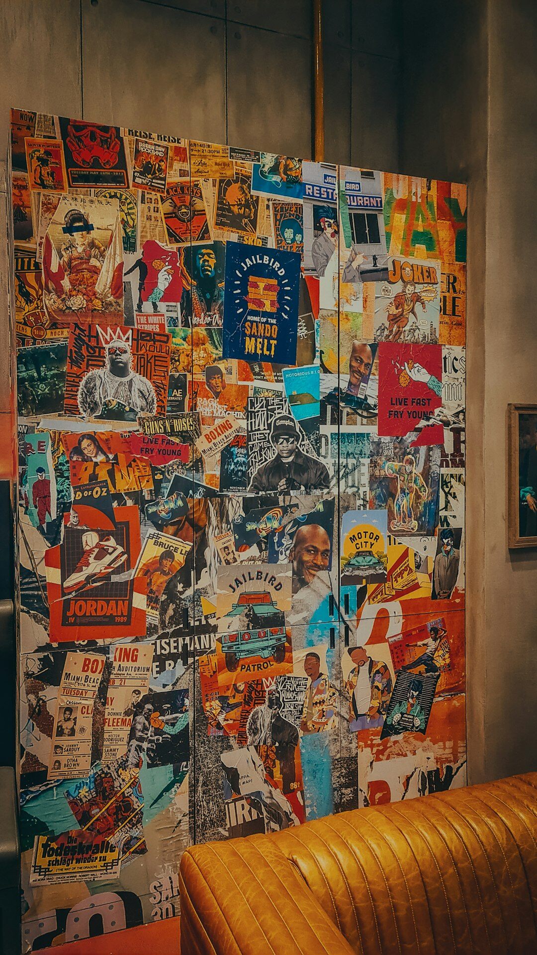 Wall covered with vintage advertising posters and magazine clippings