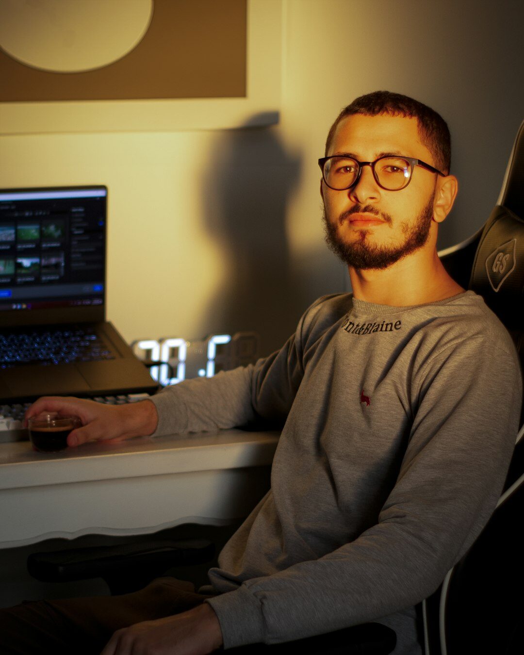 Studio portrait of a European man in his thirties, video editor